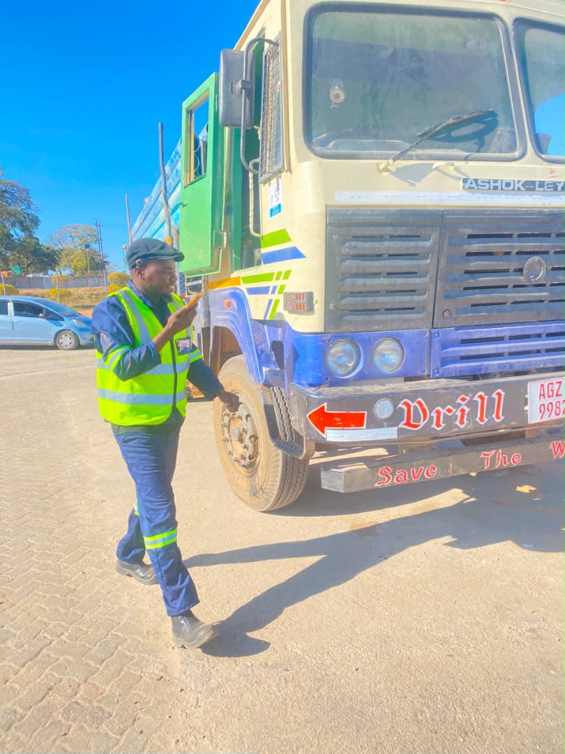 Sky Waters team member beside a drilling truck